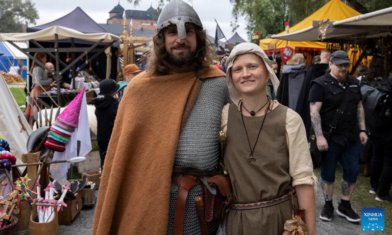 Reenactors pose for a photo at the Hame Medieval Festival in Hameenlinna, Finland on Aug. 17, 2024. The southern Finnish city of Hameenlinna hosted the Hame Medieval Festival, one of Finland's largest historical festivals, on the picturesque lakeside meadow beside Hame Castle from Aug. 16 to 18. Photo: Xinhua