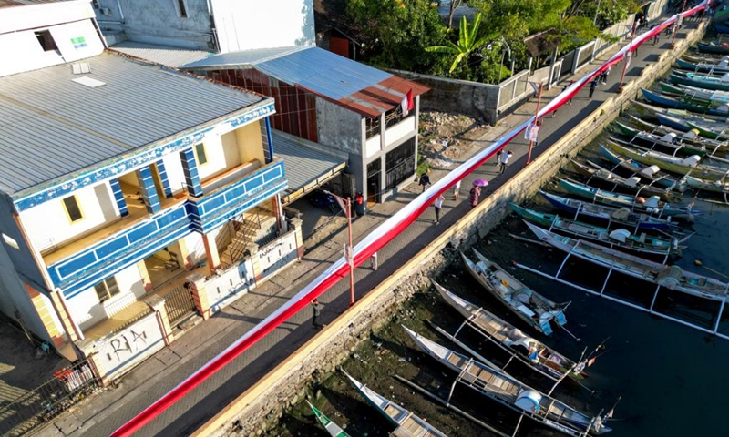 People unfold a huge Indonesian national flag to celebrate the 79th Independence Day in Makassar, South Sulawesi, Indonesia, Aug. 17, 2024. Indonesia celebrated its 79th Independence Day on Saturday. Photo: Xinhua