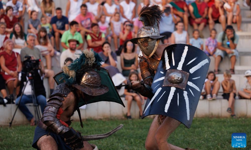 Participants dressed as gladiators show their battle skills during the Roman Games at the amphitheater in Ptuj, Slovenia, Aug. 17, 2024. The Roman Games, one of the largest presentations of the Roman period in Slovenia, was held in Ptuj on Saturday. Photo: Xinhua