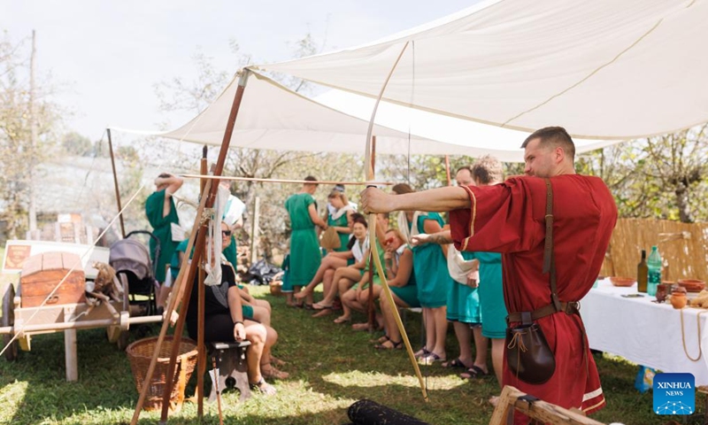 A participant dressed in Roman costumes practices in archery during the Roman Games in Ptuj, Slovenia, Aug. 17, 2024. The Roman Games, one of the largest presentations of the Roman period in Slovenia, was held in Ptuj on Saturday. Photo: Xinhua