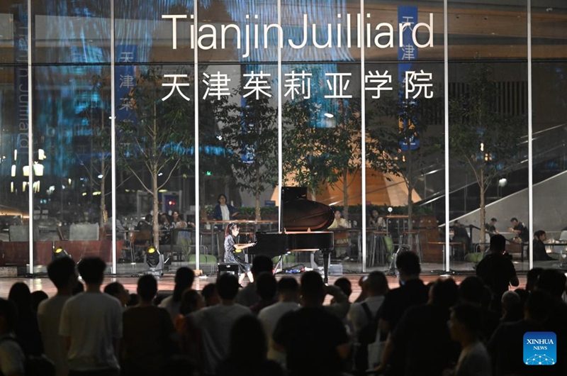 People enjoy an outdoor concert at the Tianjin Juilliard School in north China's Tianjin, Aug. 16, 2024. The outdoor concert, which kicked off here on Friday, will last until late September this year. Photo: Xinhua