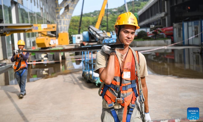 Workers operate at the construction site of Chongqing East Railway Station and affiliated comprehensive transportation hub in southwest China's Chongqing, Aug. 17, 2024. Photo: Xinhua