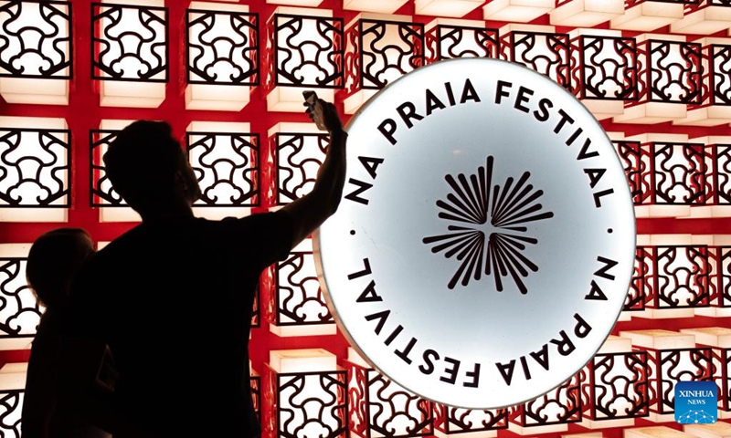 People take photos during the Na Praia Festival-China Day in Brazilia, Brazil on Aug. 17, 2024. This event was held here on Saturday in commemoration of the 50th anniversary of the establishment of diplomatic relations between China and Brazil. Photo: Xinhua