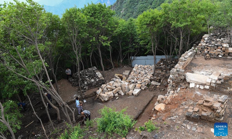 This photo shows an archaeological site of a defense tower of the Jiankou section of the Great Wall in Beijing, capital of China, July 2, 2024. Covering six defense towers, from No. 117 to No. 122, the fifth phase of the Jiankou section of the Great Wall repair project has progressed smoothly. Beijing has pioneered Great Wall archaeological research, which precedes the repair work. The Jiankou section and the Dazhuangke section in Yanqing District have been selected as pilot projects to promote research-oriented restoration and protection of the Great Wall. Photo: Xinhua