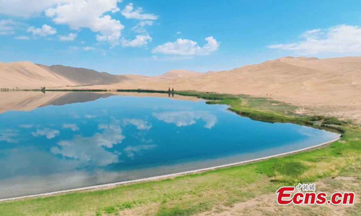 Scenery of the Badain Jaran desert in Alshaa league, north China's Inner Mongolia Autonomous Region. Sapphire-blue lakes coexist with high and low sand hills, presenting an interesting blend of barren and lush landscapes. The Badain Jaran Desert is China's third-largest desert. Scattered among the towering dunes are 144 lakes, showcasing a typical and ongoing process of aeolian landform development on Earth. It was listed on the World Heritage List in July 2024. Photo: China News Service
