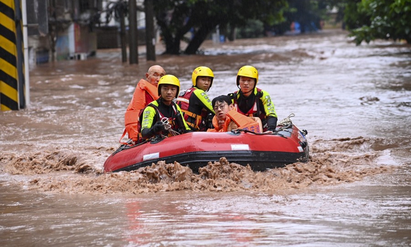 Rescuers transfer flood-trapped residents in Wanzhou District, southwest China's Chongqing Municipality, July 4, 2023.  Photo: Xinhua