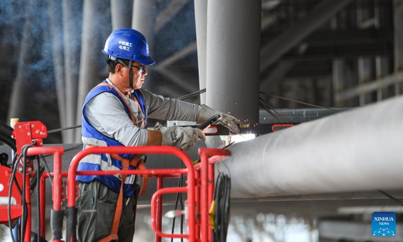 A worker operates at the construction site of Chongqing East Railway Station and affiliated comprehensive transportation hub in southwest China's Chongqing, Aug. 17, 2024. Photo: Xinhua