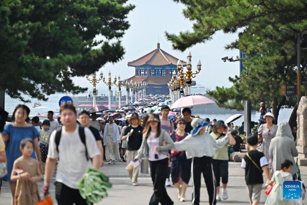 Tourists visit Zhanqiao Pier scenic spot in Qingdao, east China's Shandong Province, Aug. 17, 2024. (Photo: Xinhua)