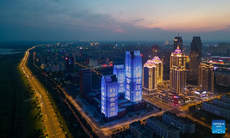 An aerial drone photo taken on July 21, 2024 shows the night view of the sub-area of Heilongjiang pilot free trade zone (FTZ) in Harbin, northeast China's Heilongjiang Province. Known as China's Ice City, Harbin has a reputation for its cool weather and diversified attractions, even during the summer months, which helps it remain attractive to tourists throughout the year. (Photo: Xinhua)