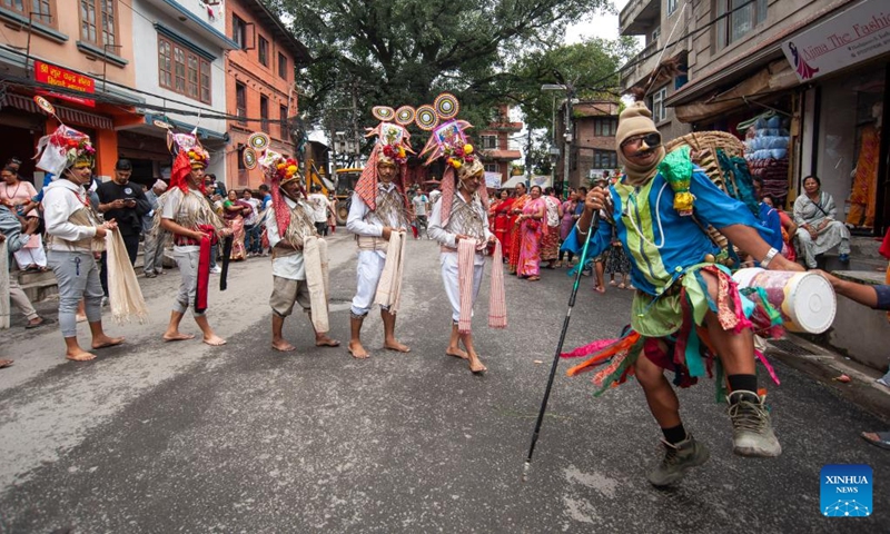 People participate in a procession to mark the Gaijatra Festival in Kathmandu, Nepal, Aug. 20, 2024. The Gaijatra Festival, or Cow Festival, is marked here on Tuesday. (Photo: Xinhua)