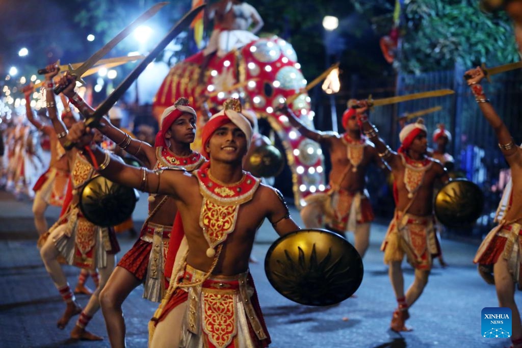 Dancers perform during a procession celebrating the Esala Perahera festival in Kandy, Sri Lanka, Aug. 19, 2024. Esala Perahera is one of the grandest Buddhist festivals in Sri Lanka, with a history of more than 1,000 years. This year's festival was held from August 10 to August 20. (Photo: Xinhua)