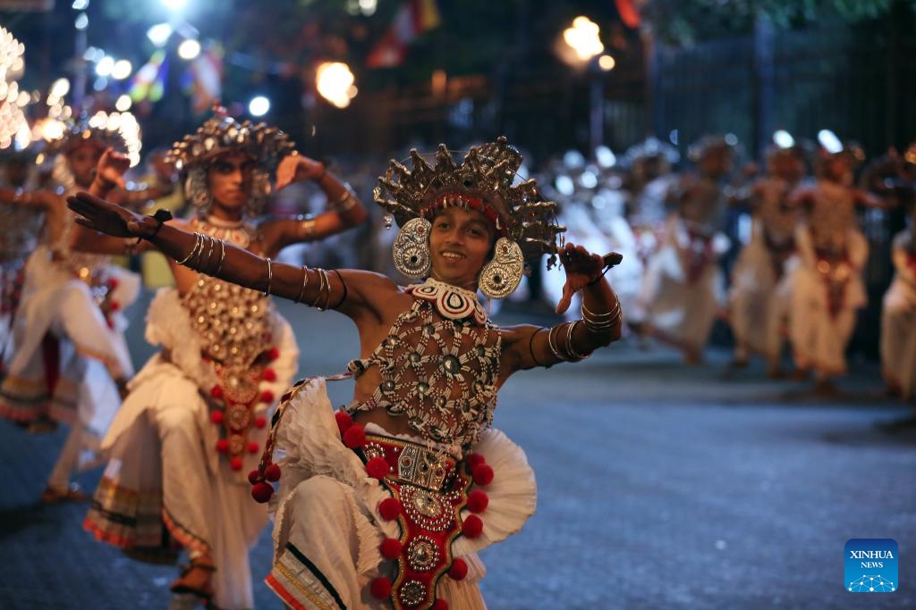 Dancers perform during a procession celebrating the Esala Perahera festival in Kandy, Sri Lanka, Aug. 19, 2024. Esala Perahera is one of the grandest Buddhist festivals in Sri Lanka, with a history of more than 1,000 years. This year's festival was held from August 10 to August 20. (Photo: Xinhua)