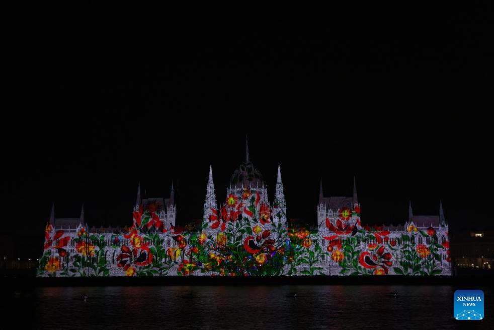 The parliament building is lit up to celebrate Hungary's state foundation day in downtown Budapest, Hungary, on Aug. 20, 2024. Hungary celebrated its state foundation day on Tuesday with a series of events across the nation, culminating in an airshow over the Danube River and a spectacular fireworks display. (Photo: Xinhua)