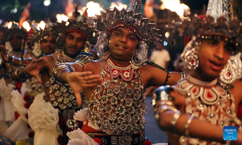 Dancers perform during a procession celebrating the Esala Perahera festival in Kandy, Sri Lanka, Aug. 19, 2024. Esala Perahera is one of the grandest Buddhist festivals in Sri Lanka, with a history of more than 1,000 years. This year's festival was held from August 10 to August 20. (Photo: Xinhua)