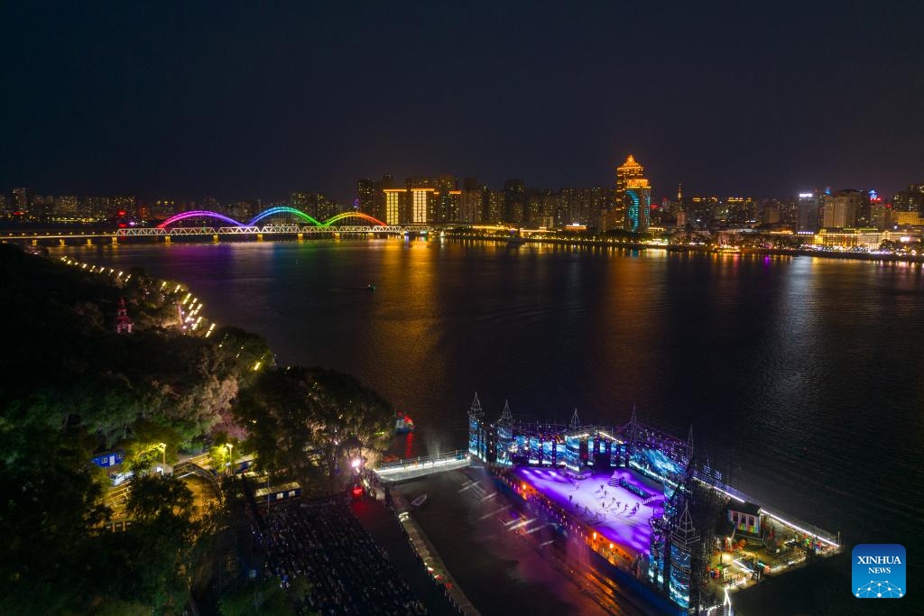 An aerial drone photo taken on June 10, 2024 shows the live-action performance Encounter Harbin staged along the Songhua River in Harbin, northeast China's Heilongjiang Province. Known as China's Ice City, Harbin has a reputation for its cool weather and diversified attractions, even during the summer months, which helps it remain attractive to tourists throughout the year. (Photo: Xinhua)