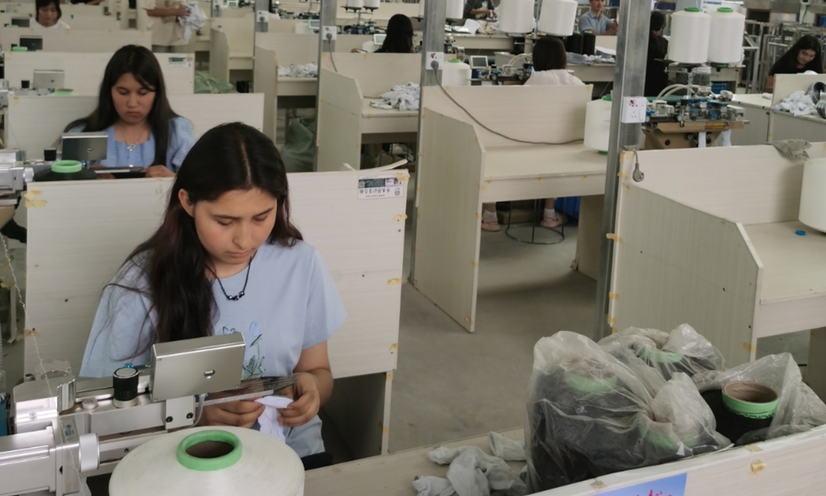 Local women work at a factory in Tong'an township that produces socks, on August 11, 2024.  Photo: Hu Yuwei/GTh