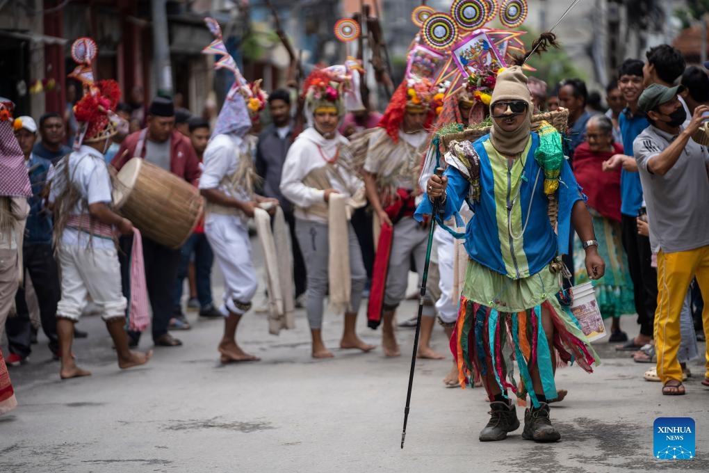 People participate in a procession to mark the Gaijatra Festival in Kathmandu, Nepal, Aug. 20, 2024. The Gaijatra Festival, or Cow Festival, is marked here on Tuesday. (Photo: Xinhua)