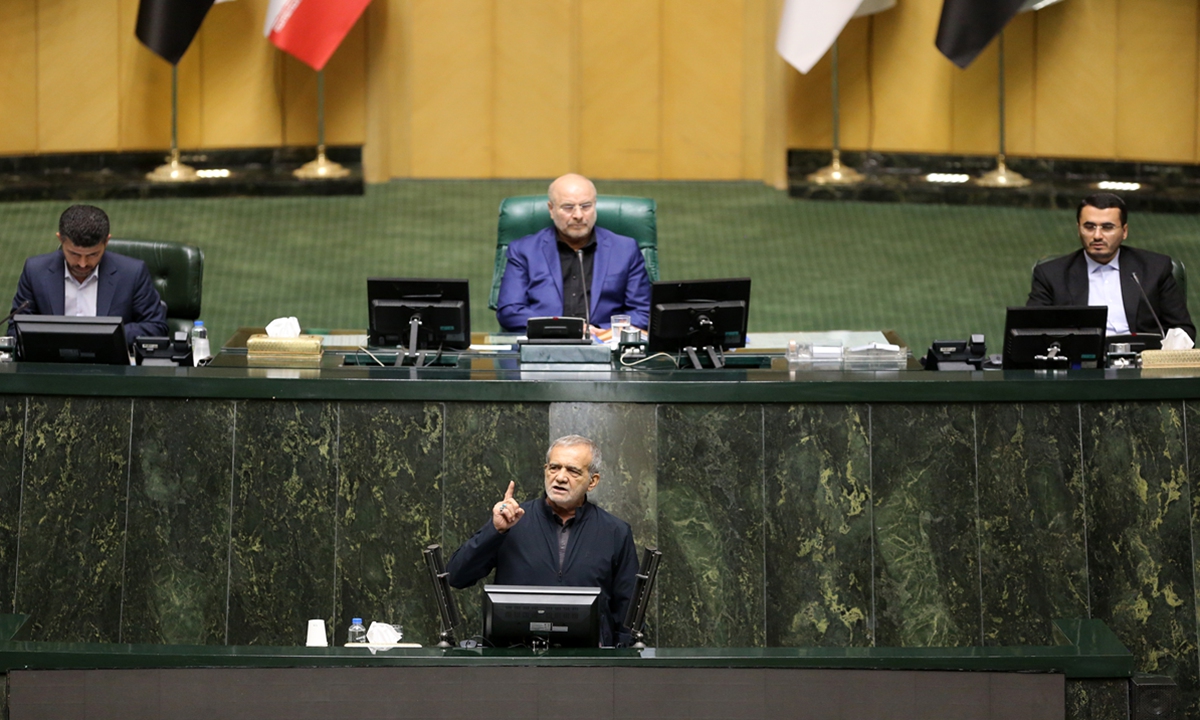 Iranian President Masoud Pezeshkian addresses the deputies ahead of a vote of confidence for ministerial nominees at the parliament in Tehran on August 21, 2024. All 19 ministers nominated by Pezeshkian received the vote of confidence from the country's top legislative body, clearing the way for the formation of the new cabinet. Photo: VCG