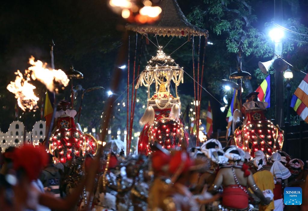 Dancers perform during a procession celebrating the Esala Perahera festival in Kandy, Sri Lanka, Aug. 19, 2024. Esala Perahera is one of the grandest Buddhist festivals in Sri Lanka, with a history of more than 1,000 years. This year's festival was held from August 10 to August 20. (Photo: Xinhua)