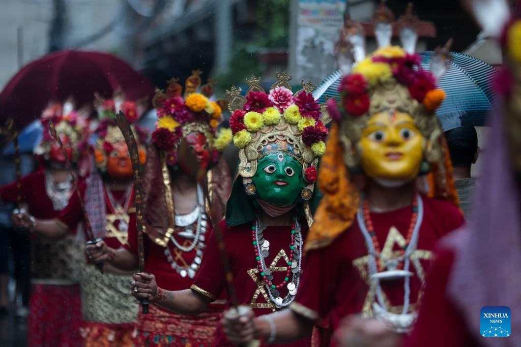 Masked dancers take part in a parade during the Khadga Jatra festival in Kathmandu, Nepal, Aug. 21, 2024. (Photo: Xinhua)