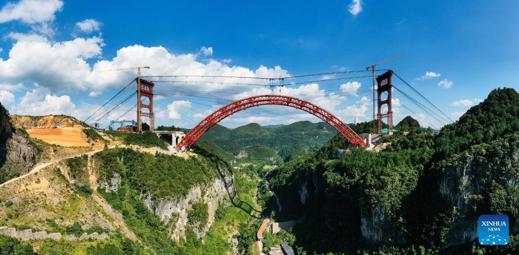 A drone photo shows the Machanghe grand bridge under construction along the Guiyang-Pingtang Expressway in southwest China's Guizhou Province, Aug. 21, 2024. The main arch of the Machanghe grand bridge along the Guiyang-Pingtang Expressway was successfully joined on Wednesday. The bridge has a length of 381.5 meters with an arch spanning 260 meters. (Photo: Xinhua)