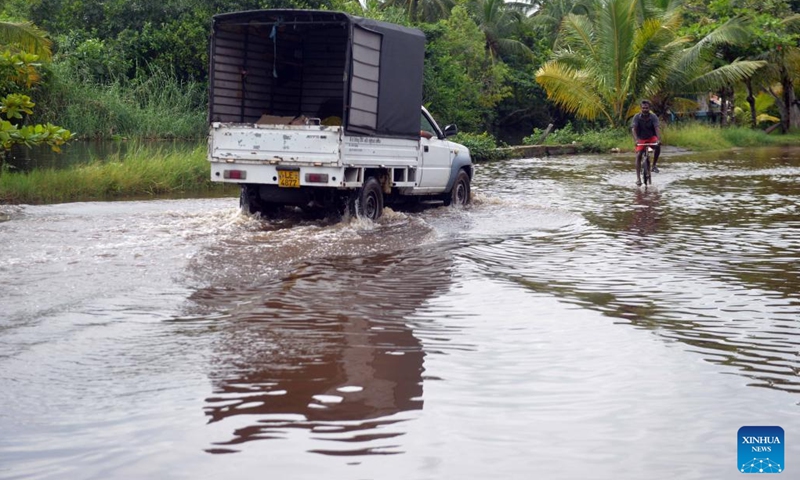 A truck rides on a waterlogged road in Wattala, Sri Lanka, Aug. 21, 2024. (Photo: Xinhua)