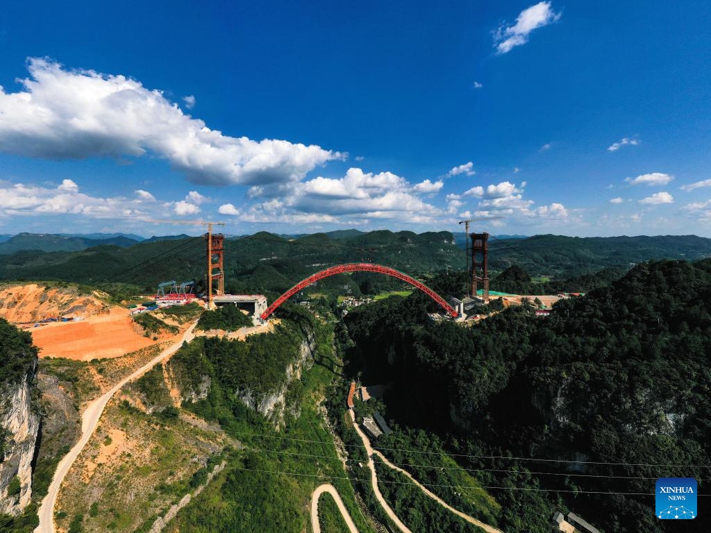 A drone photo shows the Machanghe grand bridge under construction along the Guiyang-Pingtang Expressway in southwest China's Guizhou Province, Aug. 21, 2024. The main arch of the Machanghe grand bridge along the Guiyang-Pingtang Expressway was successfully joined on Wednesday. The bridge has a length of 381.5 meters with an arch spanning 260 meters. (Photo: Xinhua)