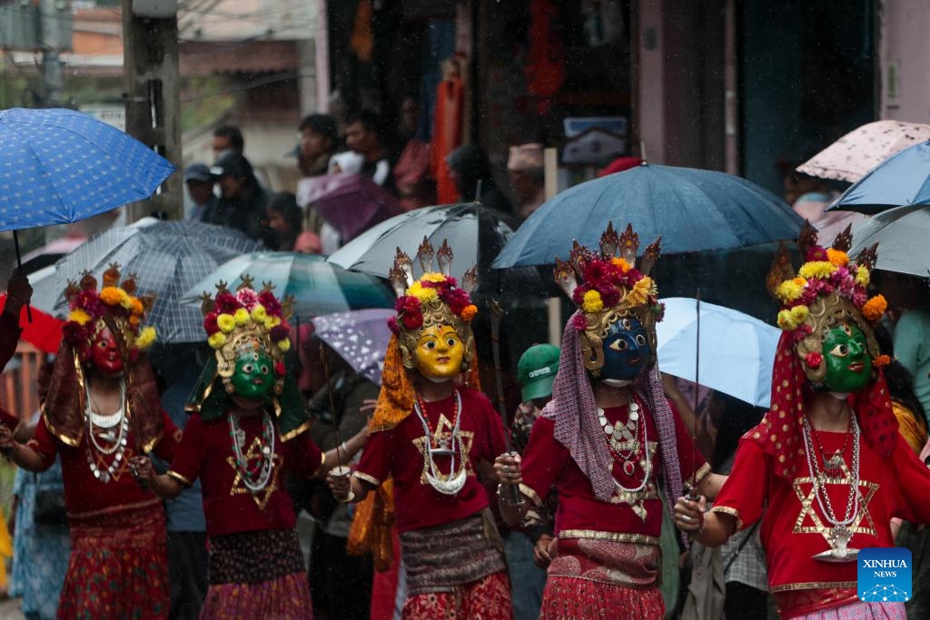 Masked dancers take part in a parade during the Khadga Jatra festival in Kathmandu, Nepal, Aug. 21, 2024. (Photo: Xinhua)