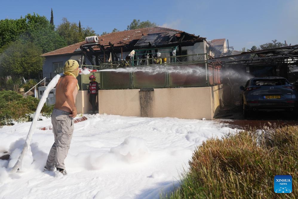 A man works at a house directly hit by a rocket from Lebanon, in Katzrin of Israeli-annexed Golan Heights, on Aug. 21, 2024. Lebanese militant group Hezbollah fired at least 50 rockets at northern Israel Wednesday morning after Israeli warplanes struck several areas overnight and in the morning in Lebanon, killing at least three people, according to Israeli and Lebanese sources. (Photo: Xinhua)