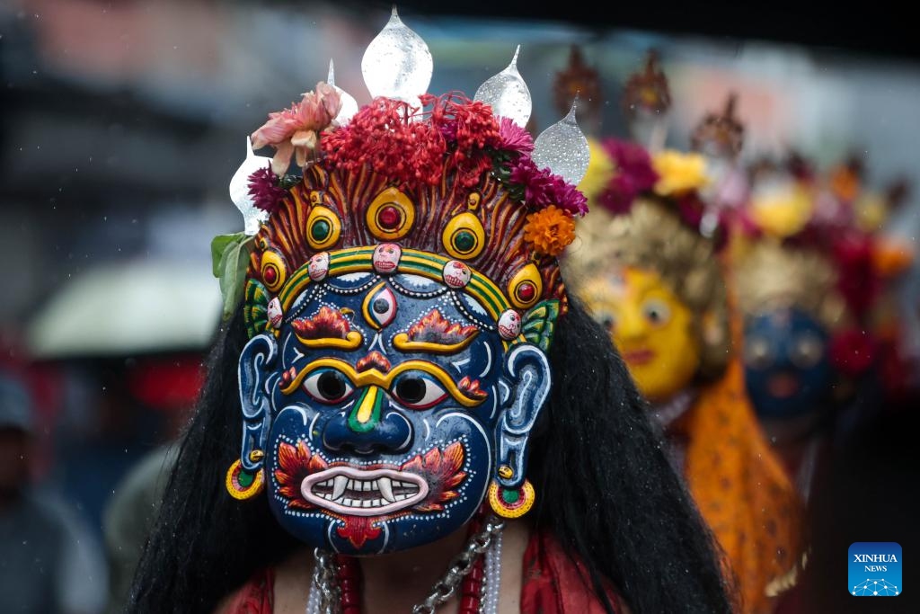 Masked dancers take part in a parade during the Khadga Jatra festival in Kathmandu, Nepal, Aug. 21, 2024. (Photo: Xinhua)