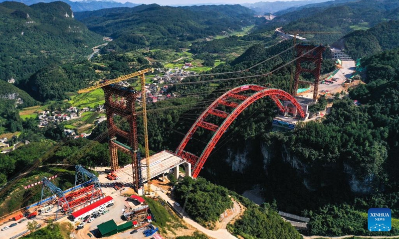 A drone photo shows the Machanghe grand bridge under construction along the Guiyang-Pingtang Expressway in southwest China's Guizhou Province, Aug. 21, 2024. The main arch of the Machanghe grand bridge along the Guiyang-Pingtang Expressway was successfully joined on Wednesday. The bridge has a length of 381.5 meters with an arch spanning 260 meters. (Photo: Xinhua)