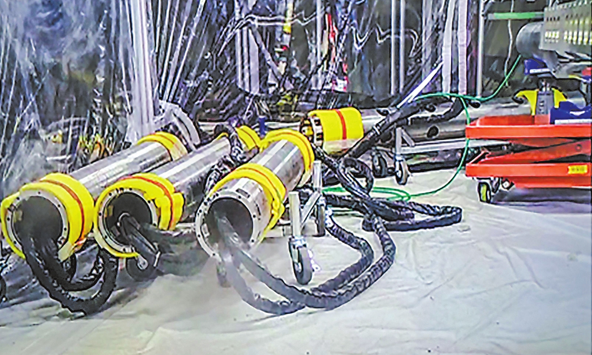 Pictured are the pipes for the installation of a telescopic device to be used for the removal of radioactive debris at TEPCO's Fukushima Daiichi nuclear power plant unit 2 in Okuma, Fukushima prefecture. However, the plan was suspended due to a problem discovered with the installation of a removal device. Photo: VCG