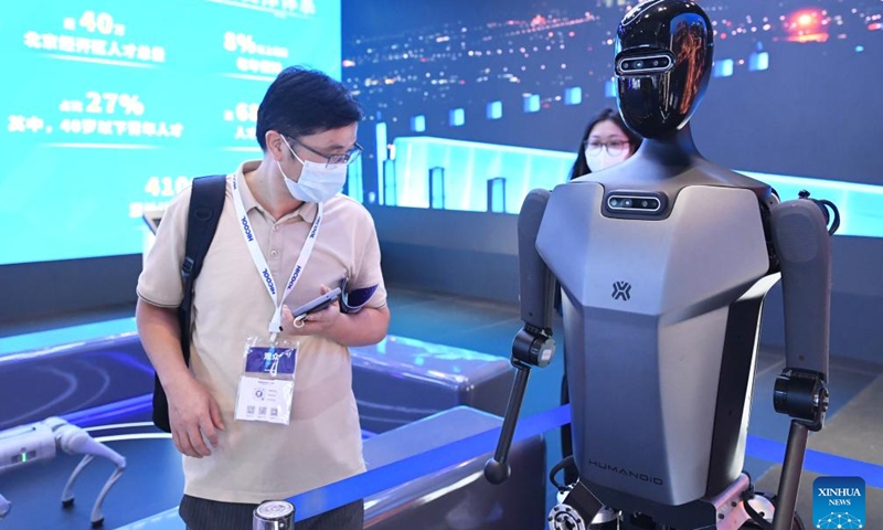 People visit the exhibition area of HICOOL 2024 Global Entrepreneur Summit in Beijing, capital of China, Aug. 24, 2024. The global entrepreneur summit was held in Beijing from Friday to Sunday. (Xinhua/Ren Chao)