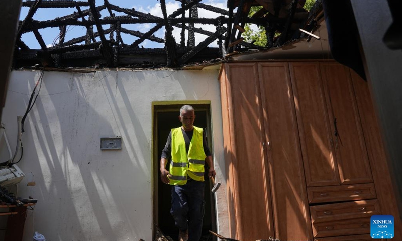 A man is seen at a house directly hit in a rocket attack from Lebanon, in Kiryat Shmona, northern Israel, on Aug. 24, 2024. (Ayal Margolin/JINI via Xinhua)