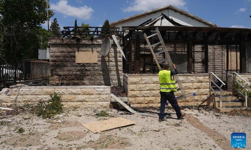 A man is seen at a house directly hit in a rocket attack from Lebanon, in Kiryat Shmona, northern Israel, on Aug. 24, 2024. (Ayal Margolin/JINI via Xinhua)