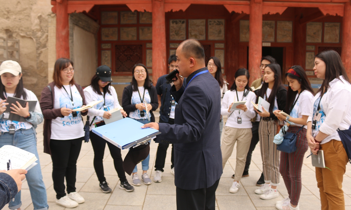 Hong Kong students take part in a training session at the Mogao Grottoes in Dunhuang, Northwest China's Gansu Province.   Photo: Courtesy the Home and Youth Affairs Bureau of the Hong Kong Special Administrative Region