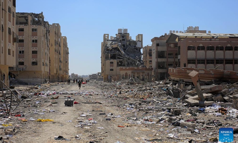 Residential buildings destroyed by Israeli warplanes are pictured at the Hamad City, in the southern Gaza Strip city of Khan Younis, on Aug. 24, 2024. (Photo by Rizek Abdeljawad/Xinhua)