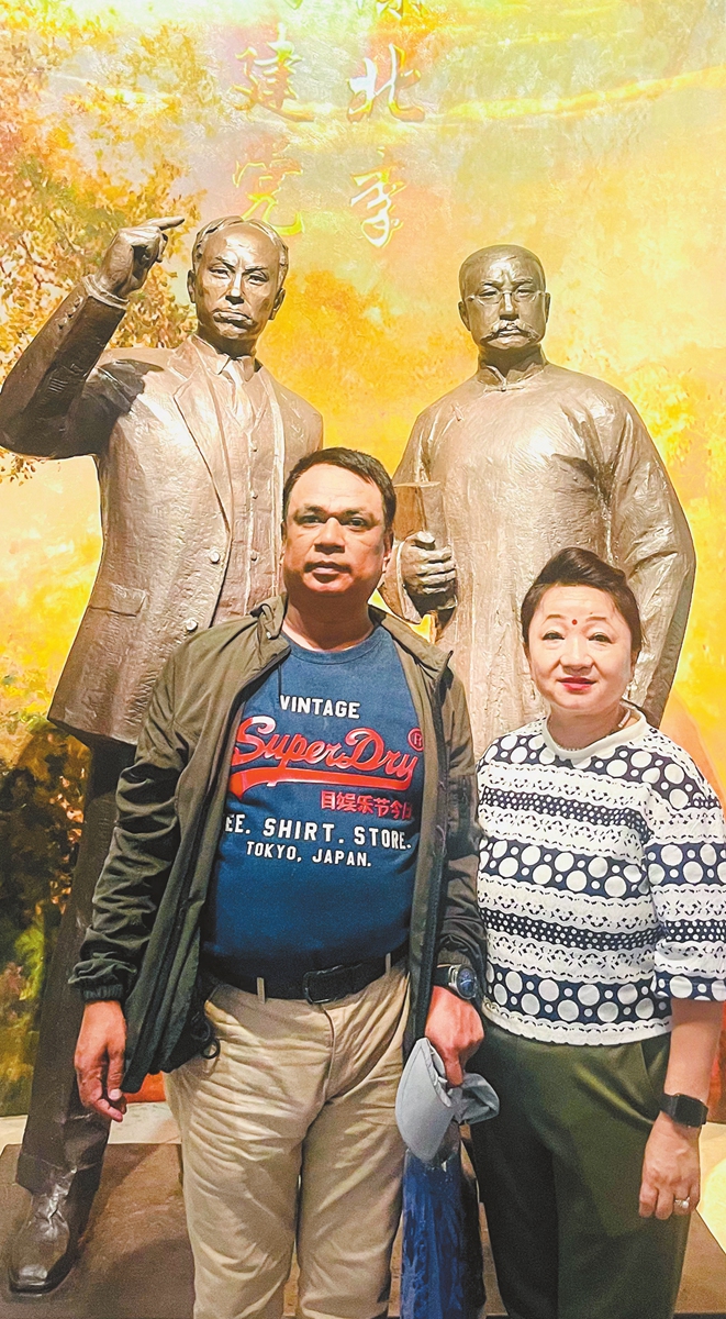 Nepalese travel vloggers Nagendra Bhujel and Ananda Kala Rai pose for a photo at the Memorial of the First National Congress of the CPC on June 21, 2024. Photo: Courtesy of Bhujel