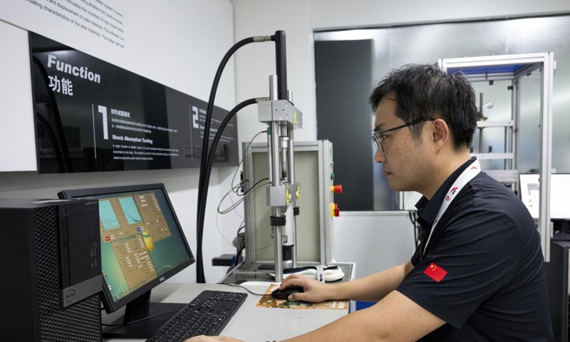 A staff member works at a laboratory of China's sportswear giant Anta in Jinjiang, southeast China's Fujian Province, Aug. 22, 2024. Jinjiang, a county-level city covering a total area of 649 square kilometers, is home to some 96,000 private enterprises that contributed over 90 percent of the city's industrial output, tax revenue and job opportunities in 2023. (Xinhua/Wei Peiquan)

