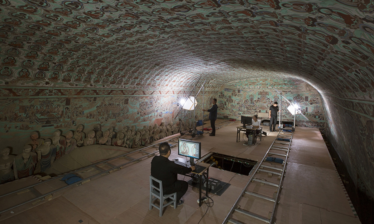 Digital preservation experts collect digital data on the murals at the Mogao Caves. Photo: Courtesy of the Dunhuang Academy 