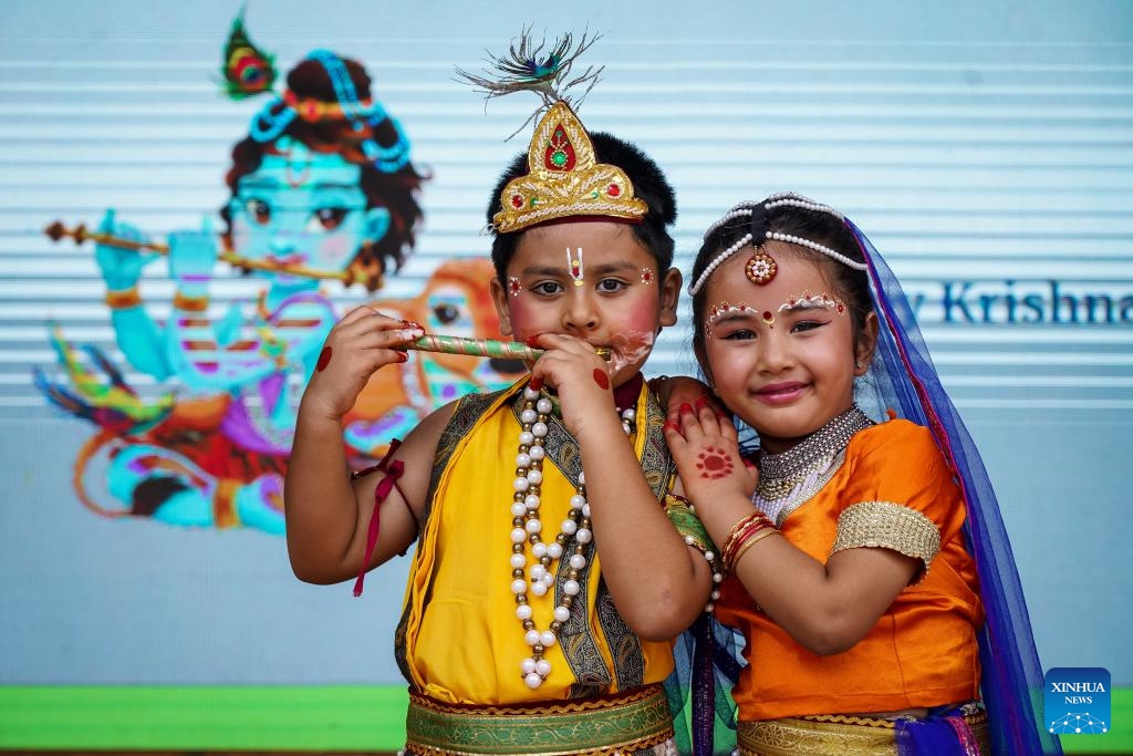 A boy and a girl dressed as Lord Krishna and Goddess Radha pose for photos during the Krishna Janmashtami festival in Bhaktapur, Nepal, Aug. 26, 2024. Krishna Janmashtami festival is celebrated annually to mark the birth anniversary of Hindu God Krishna. (Photo: Xinhua)