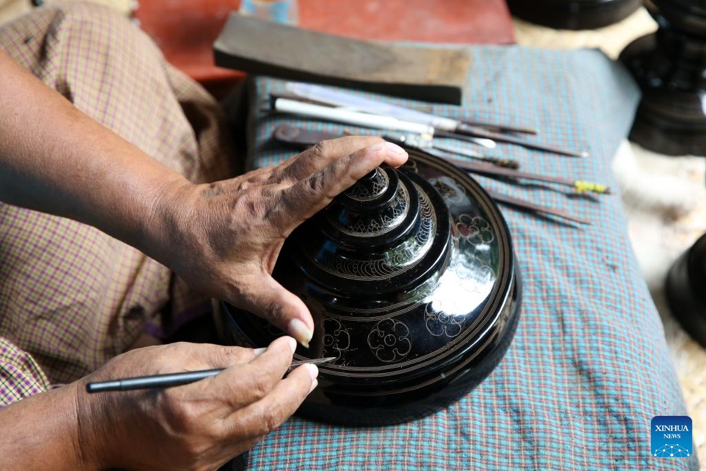 A man carves on a lacquerware at a workshop in Bagan, Myanmar, Aug. 24, 2024. (Photo: Xinhua)