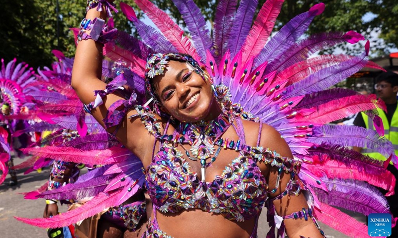 A performer participates in Notting Hill Carnival in London, Britain, on Aug. 26, 2024. Originated in the 1960s, the carnival is a way for Afro-Caribbean communities to celebrate their cultures and traditions. (Photo: Xinhua)