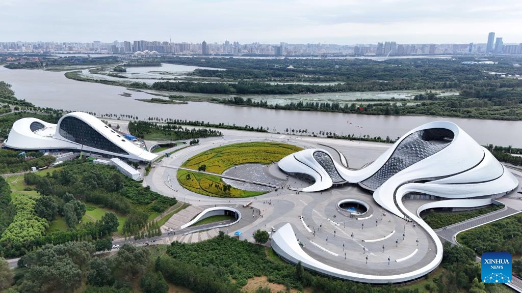 An aerial drone photo taken on Aug. 20, 2024 shows a view of the Harbin Grand Theatre in Harbin, northeast China's Heilongjiang Province. Known as China's Ice City, Harbin has a reputation for its cool weather and diversified attractions, even during the summer months, which helps it remain attractive to tourists throughout the year. (Photo: Xinhua)