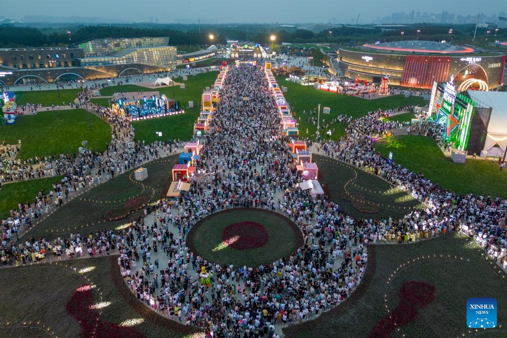 An aerial drone photo taken on July 6, 2024 shows people visiting the China Harbin International Beer Festival in Harbin, northeast China's Heilongjiang Province. Known as China's Ice City, Harbin has a reputation for its cool weather and diversified attractions, even during the summer months, which helps it remain attractive to tourists throughout the year. (Photo: Xinhua)