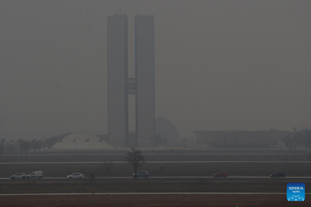 This photo taken on Aug. 26, 2024 shows the National Congress building shrouded in smoke in Brasilia, Brazil. (Photo: Xinhua)