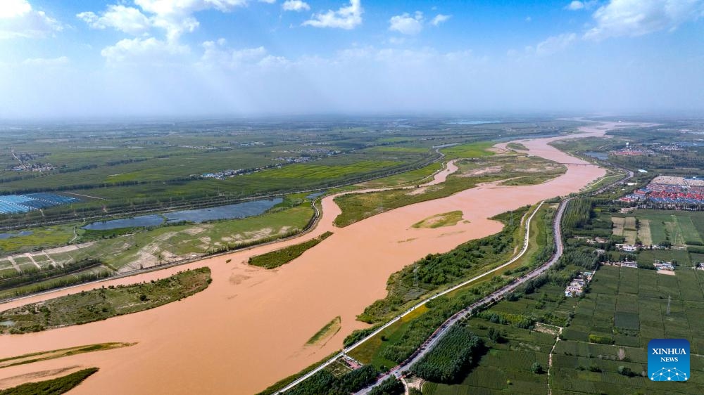 An aerial drone photo taken on Aug. 23, 2024 shows a section of the Yellow River in Qingtongxia City, northwest China's Ningxia Hui Autonomous Region. In recent years, Ningxia has attached great importance to the protection and management of the Yellow River. The region has stepped up efforts to improve the ecological environment in the watershed areas of the river. (Photo: Xinhua)