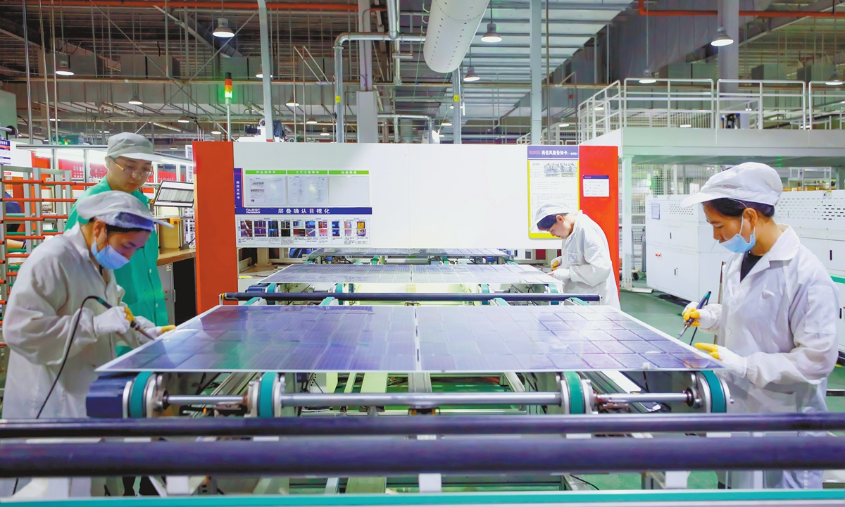 Workers are busy filling photovoltaic module orders on a production line in Suqian, East China's Jiangsu Province on August 28, 2024. From January to July, new solar installations in China totaled 123.53 gigawatts, a year-on-year increase of 27 percent, maintaining steady growth. Photo: VCG