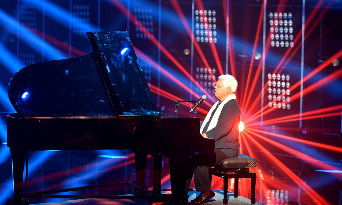 Hu Defu, the father of folk music on the island of Taiwan, also known as Ara Kimbo in his indigenous language, plays the piano at opening ceremony of a cross-Straits TV series and film event in Xiamen, East China's Fujian, on June 17, 2023. Photo: VCG