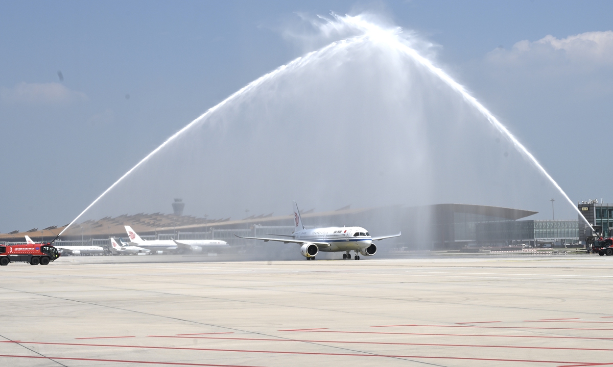 Welcomed with a water cannon salute, the home-made C919 aircraft, with the registration number of B-919X, lands smoothly at the Beijing Capital International Airport on August 29, 2024. Photo: Courtesy of Air China